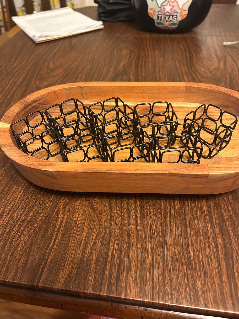 Eight black metal cubes napkin rings